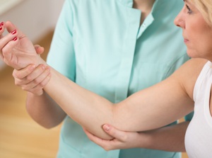 Education about treating elbow pain with auto accident injury care